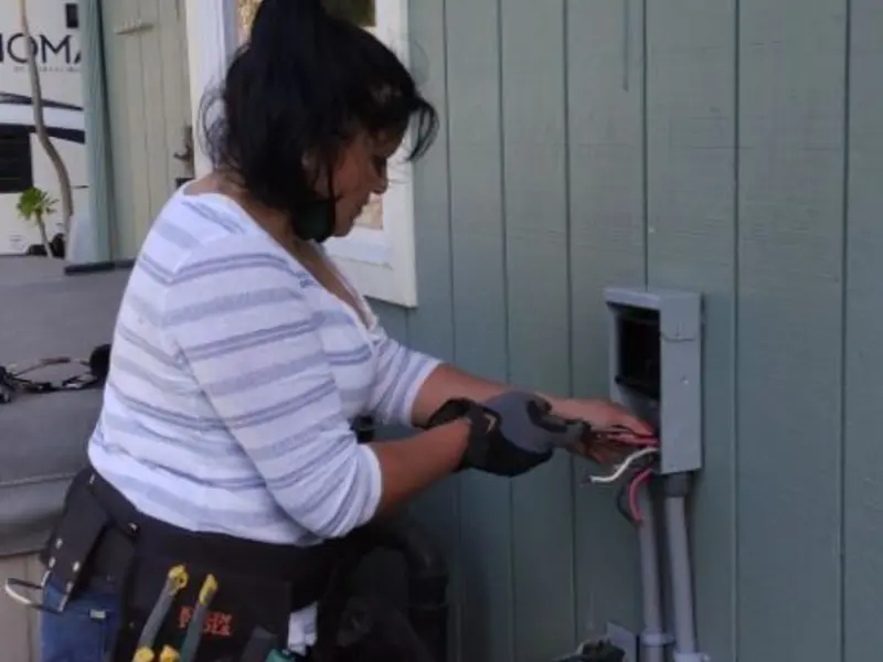 Licensed electrician wiring an exterior subpanel in Leisure World